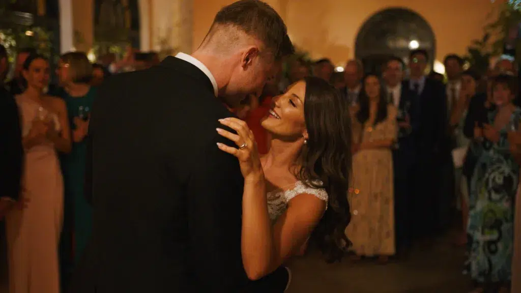 Bride and groom sharing their first dance, captured in a romantic and cinematic wedding film moment.